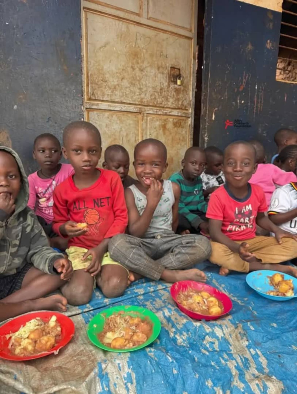 Children sharing a meal in the community
