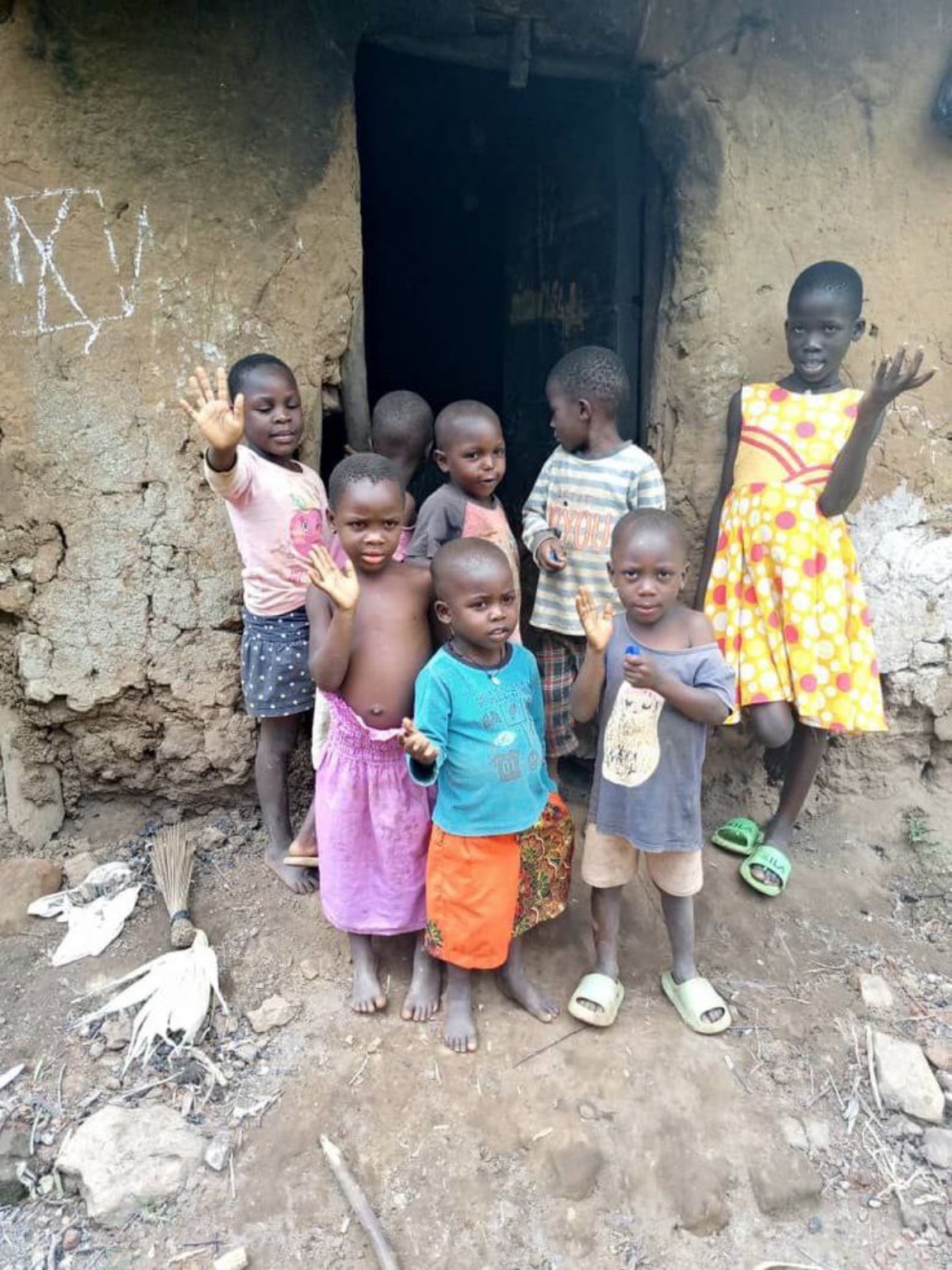 Children outside a modest home